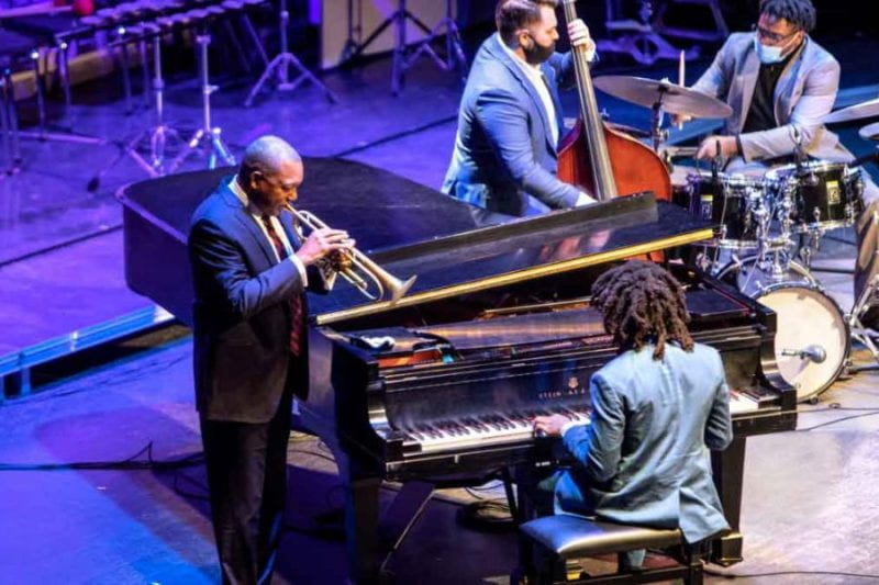 Wynton Marsalis (left) plays with members of his quintet – Philip Norris (bass), Sean Mason (piano) and Domo Branch (drums) – Nov. 6 at Bailey Hall. Not photographed is Abdias Armenteros (tenor sax, soprano sax). Photo credit: Ryan Young/Cornell University